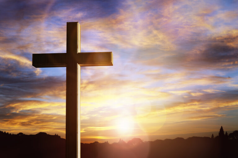 Crucifix cross at sunset background, crucifixion of Jesus Christ